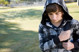 Teenage boy with school backpack